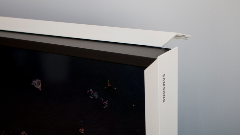 Here’s the corner of the Frame with the optional “customizable bezel” partially removed. The black bezel underneath is what the naked TV looks like. The decorate white bezel snaps on with magnets and costs over $200.
